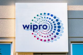 Wipro logo on a white sign against a grey building