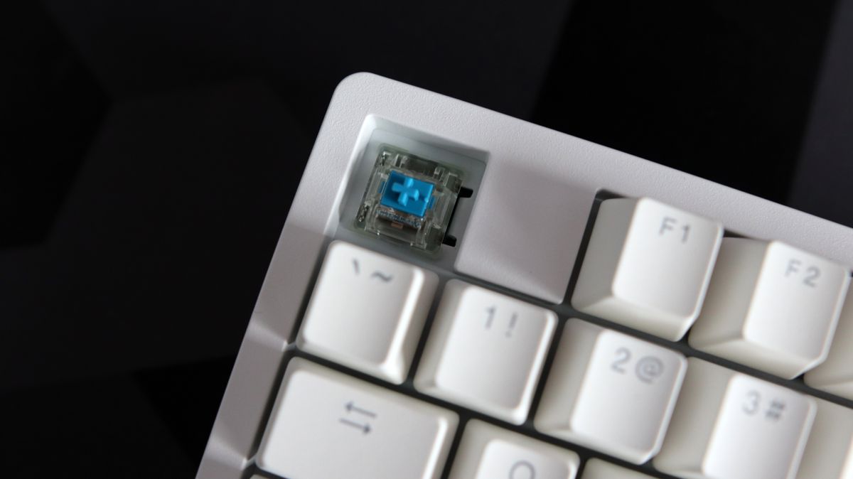 Ducky Zero 6108 gaming keyboard in white on a desk.