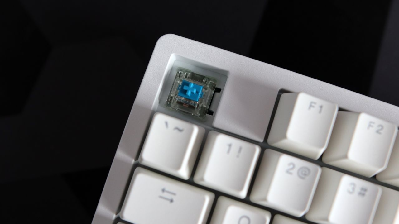 Ducky Zero 6108 gaming keyboard in white on a desk.