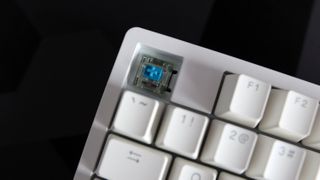 Ducky Zero 6108 gaming keyboard in white on a desk.