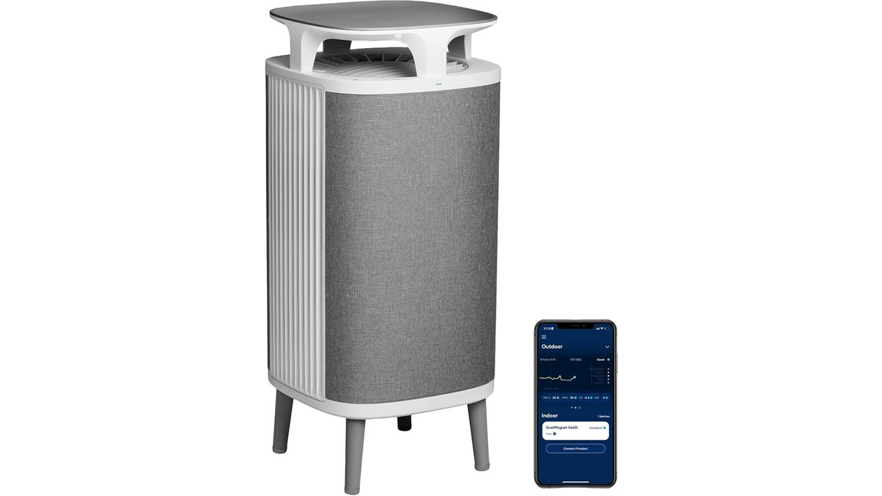 A BlueAir DustMagnet 5440i on a white background, with a phone showing the app next to it.