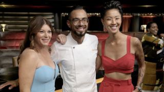 Kristen Kish and Gail Simmons smiling with winner Danny Garcia in Top Chef Season 21 finale