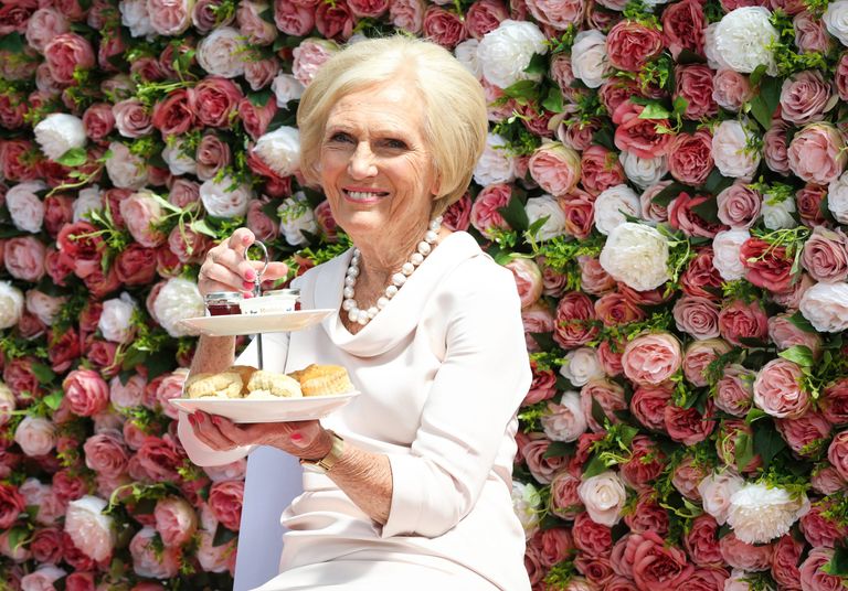 Mary Berry holding cakestand