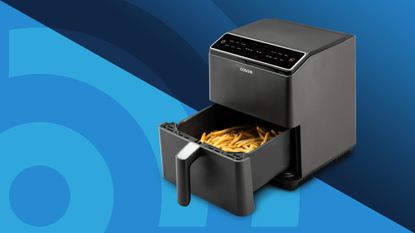 Cosori air fryer with fries on blue background