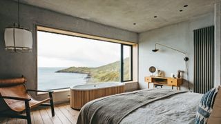 bedroom with huge picture window and concrete walls and ceiling