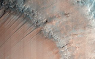 The gullies seen here are one of numerous examples on Mars, showing water flowing in the ancient past.