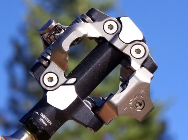 The center of the pedal is ovalized top to bottom, leaving more room at the front and back to pass mud and debris.