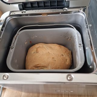 Breville Custom Loaf Bread Maker with a white loaf freshly cooked inside