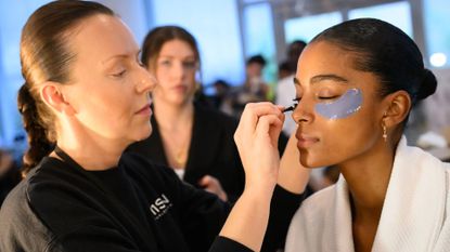 woman wearing best under eye patches at fashion week