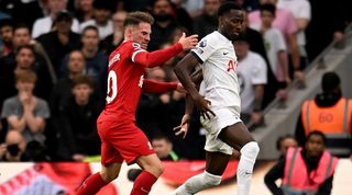 Liverpool midfielder Alexis Mac Allister challenges Tottenham's Pape Matar Sarr in the teams' Premier League clash in north London in September 2023.
