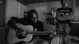 Cedric Burnside with his youngest daughter, Portrika, at his home near Holly Springs, Mississippi, in 2020