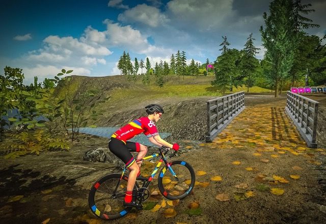 A virtual rider heading for a bridge on Wahoo RGT&#039;s Dunoon Crossover