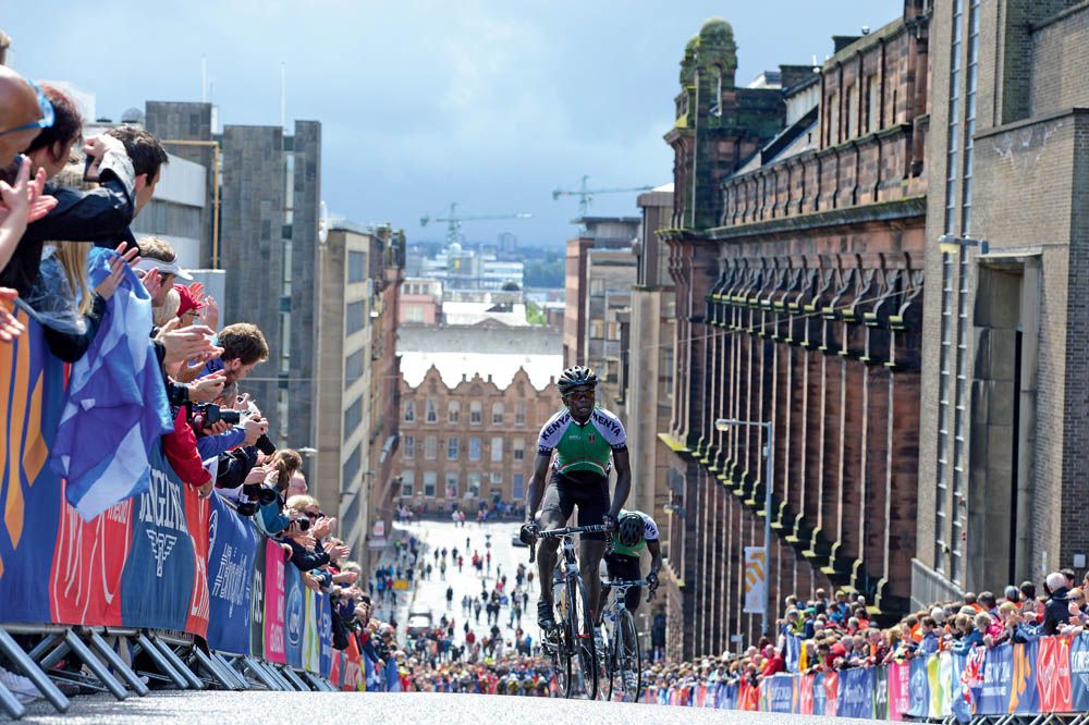 Commonwealth Games, Montrose Street in Glasgow. A rare window of sunshine, tiny stick-like figures at the bottom of the street and the cranes against the Glaswegian skyline helped give this image an almost Lowry-esque feel. 