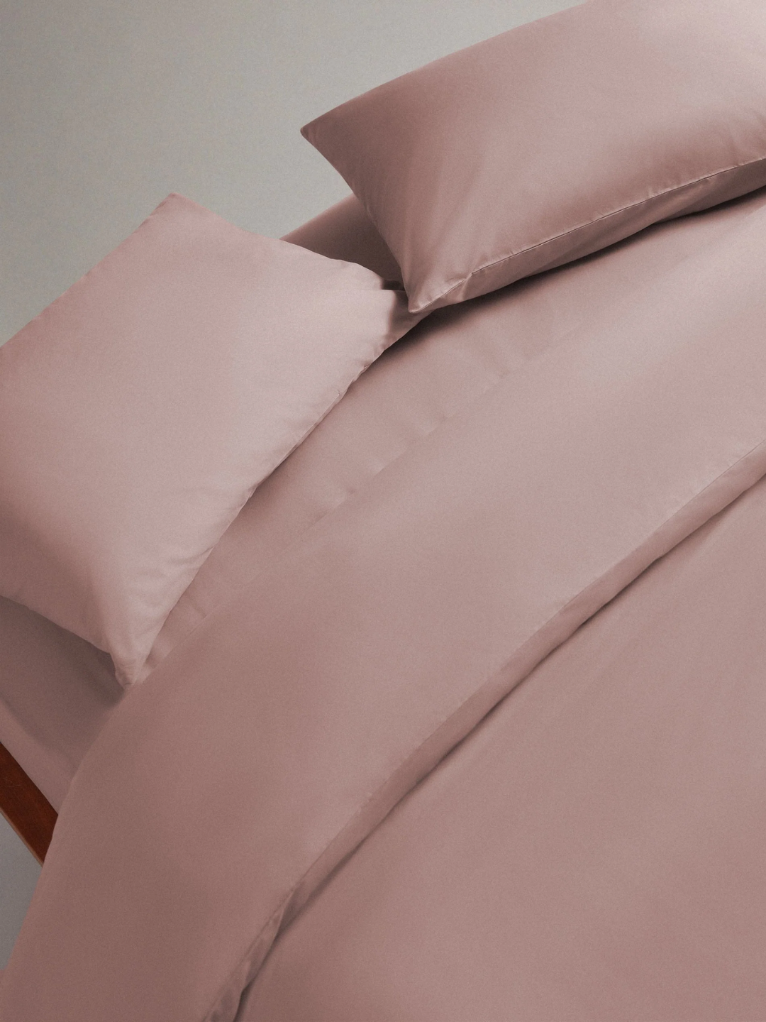 A clay-colored cool organic cotton fitted sheet from Rise &amp;amp; Fall