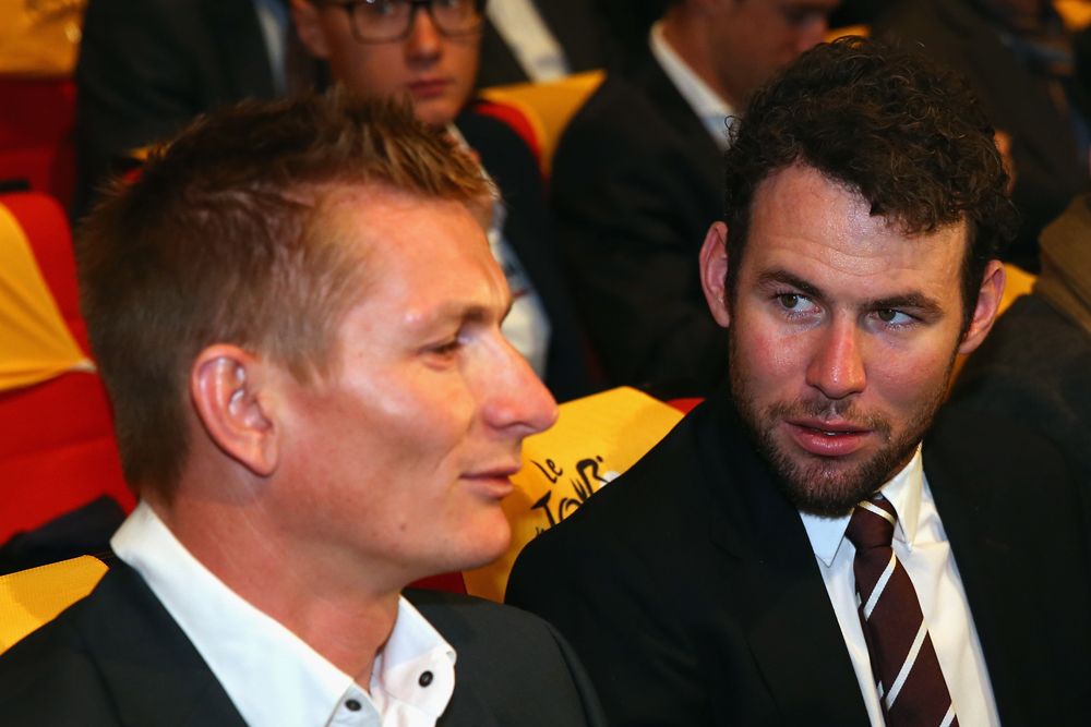 An exchange between sprinters Andre Greipel and Mark Cavendish