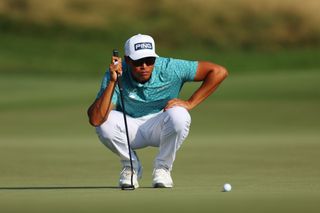 Johannes Veerman lines up a putt on the green