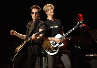 Earl Slick and David Bowie in 2002