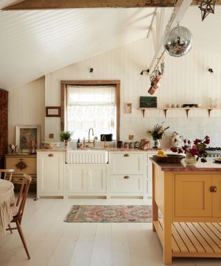 All-white kitchen with ivory worktops and cupboards