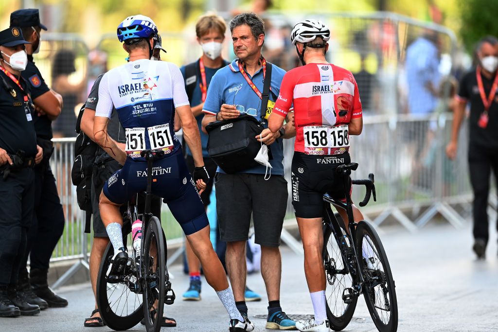 ALBACETE SPAIN AUGUST 18 LR Sep Vanmarcke of Belgium and Mads Wrtz Schmidt and Denmark and Team Israel StartUp Nation crosses the finishing line injured after crash during the 76th Tour of Spain 2021 Stage 5 a 1844km stage from Tarancn to Albacete lavuelta LaVuelta21 on August 18 2021 in Albacete Spain Photo by Stuart FranklinGetty Images