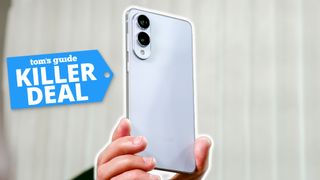 Galaxy S25 Edge held in the hand with killer deal badge nearby.