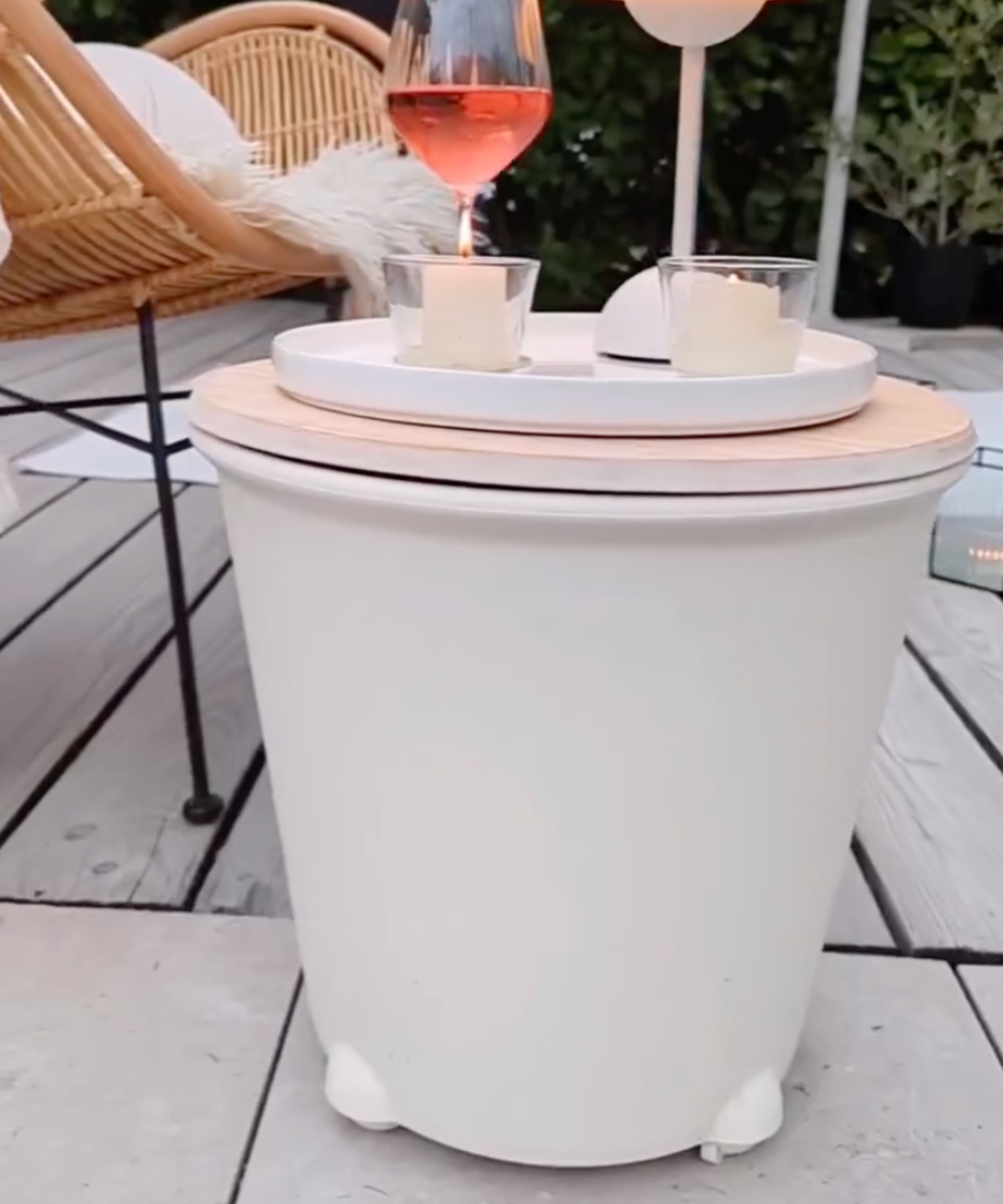 A garden side table on wheels made with an IKEA planter