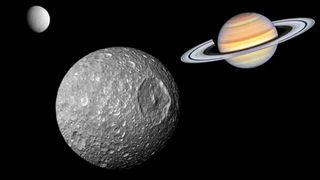 An illustration shows Saturn's moon 'Death Star' moon Mimas with the gas giant and Enceladus in the background.