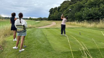 Female golfers on the tee