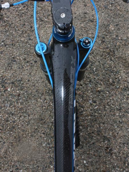 The top tube flares in width as it approaches the head tube.