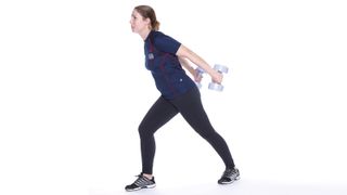 Woman doing a tricep kick back as part of a dumbbell arms workout