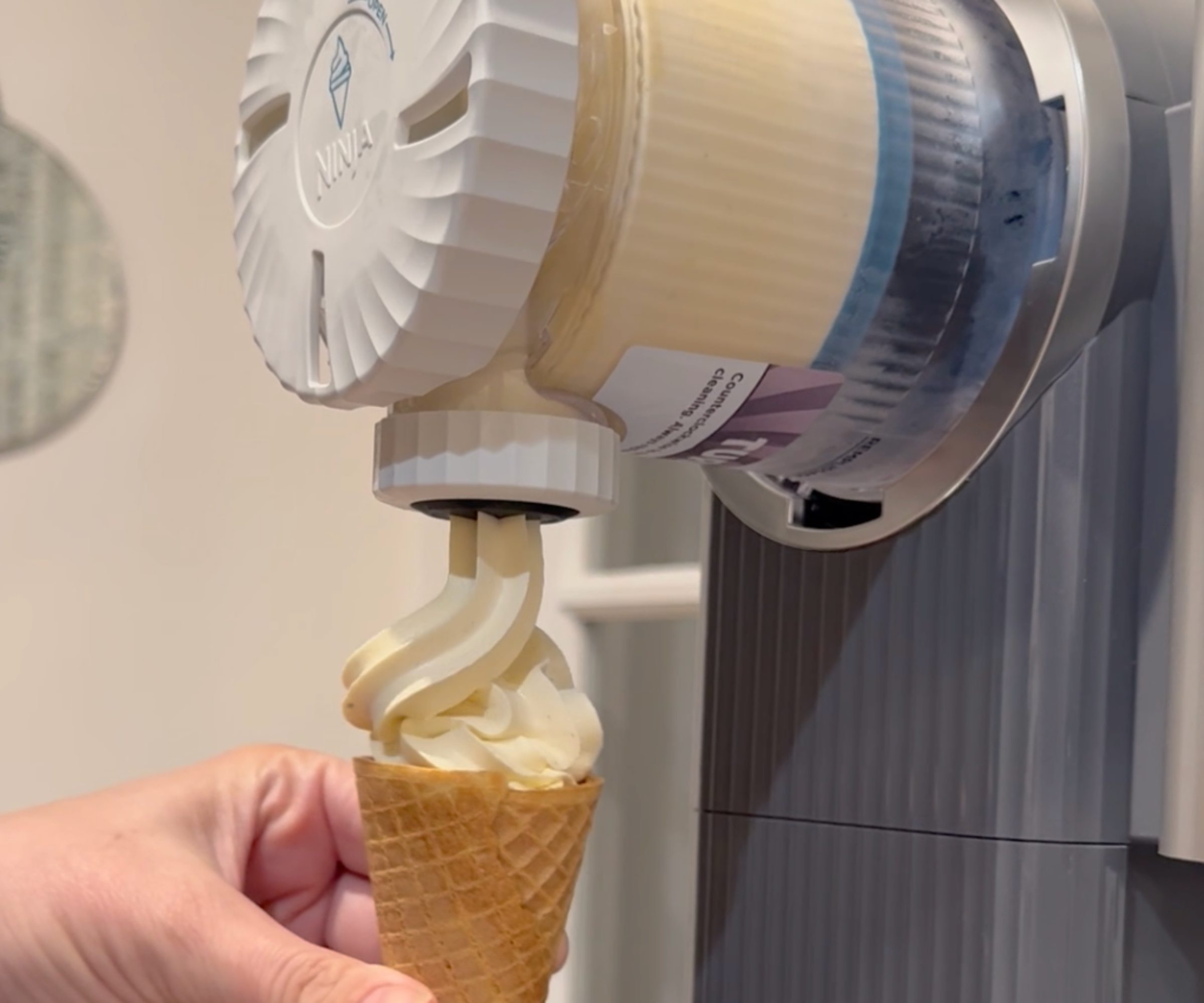 The Ninja Swirl pouring soft-serve into my cone
