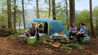 Vango Beta 550XL CLR with four people camping in woods