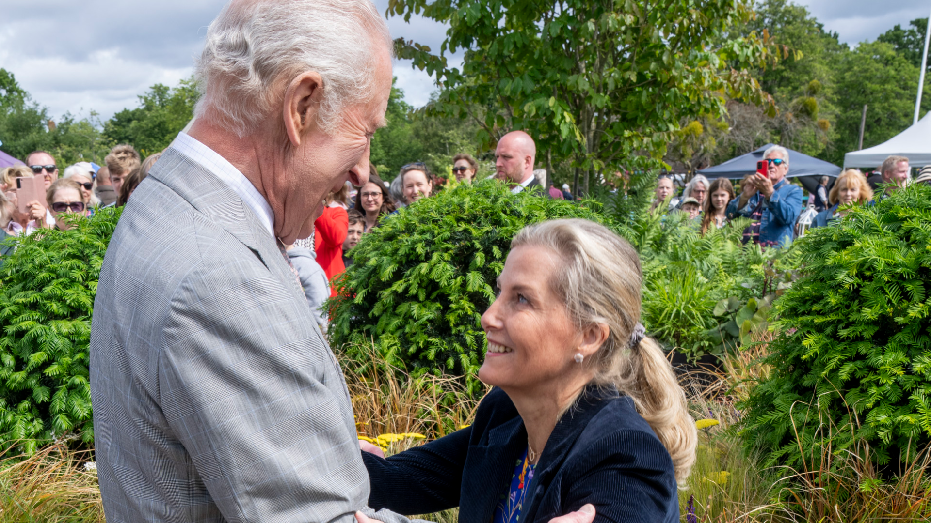 Duchess Sophie curtseying to King Charles at a flower show