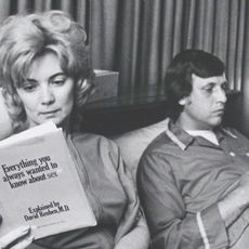 couple in bed reading sex relationship marriage advice