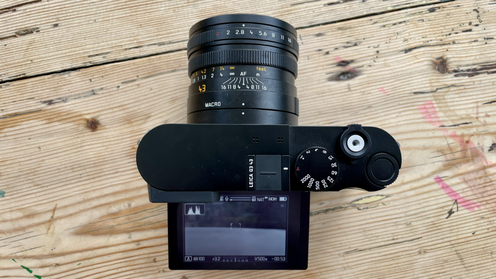 Leica Q3 43 camera on a wooden table