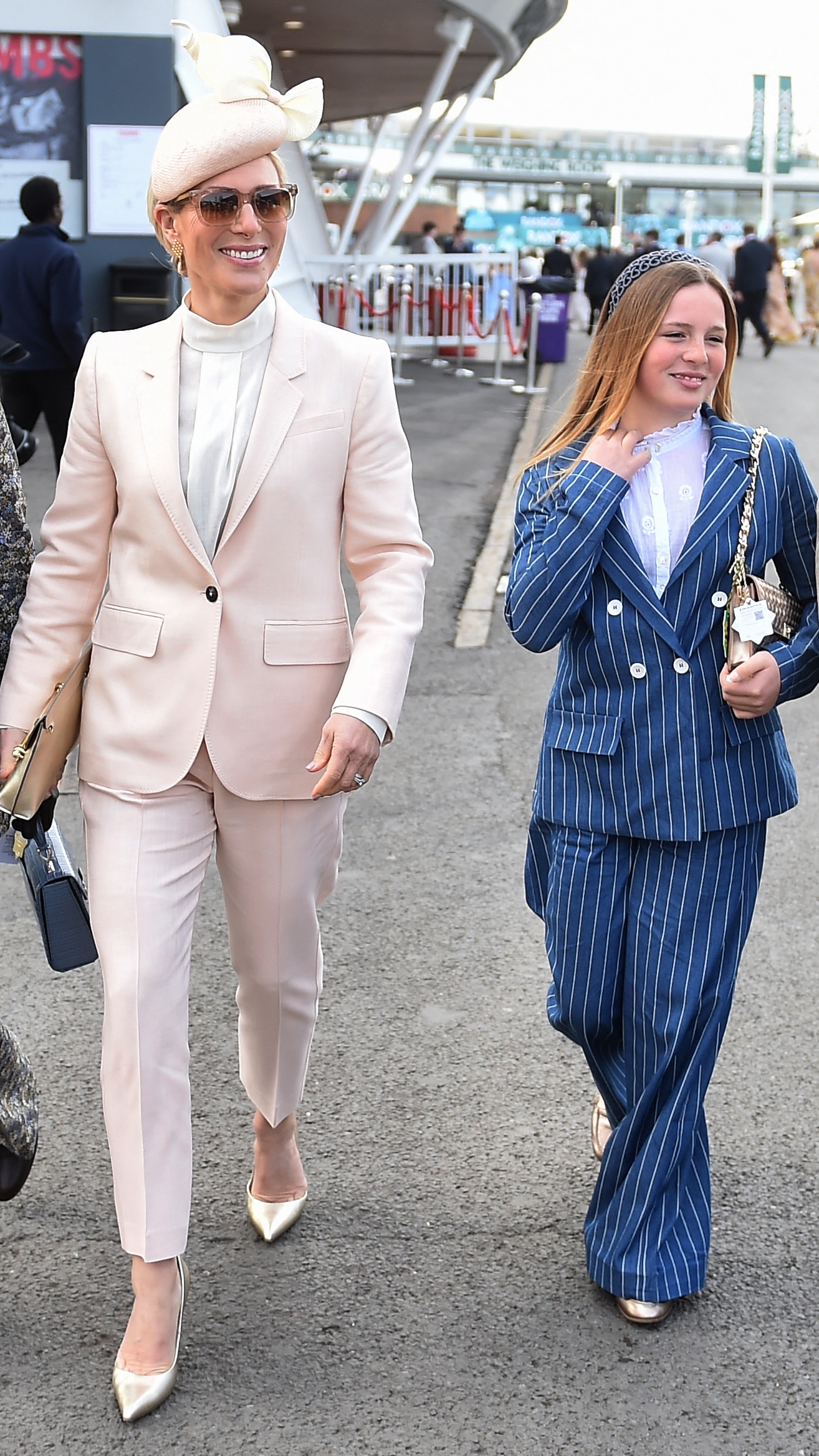 Zara Tindall and Mia arrive on Ladies Day, day two of the Grand National Festival horse race meeting