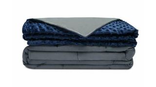 Best weighted blankets: the Quilty Weighted Blanket in blue with a reversible grey side