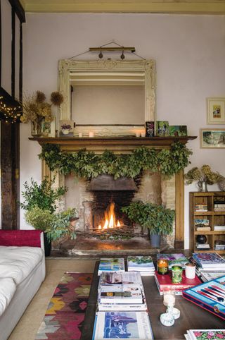 foliage garland around fireplace in florist Willow Crossley's house