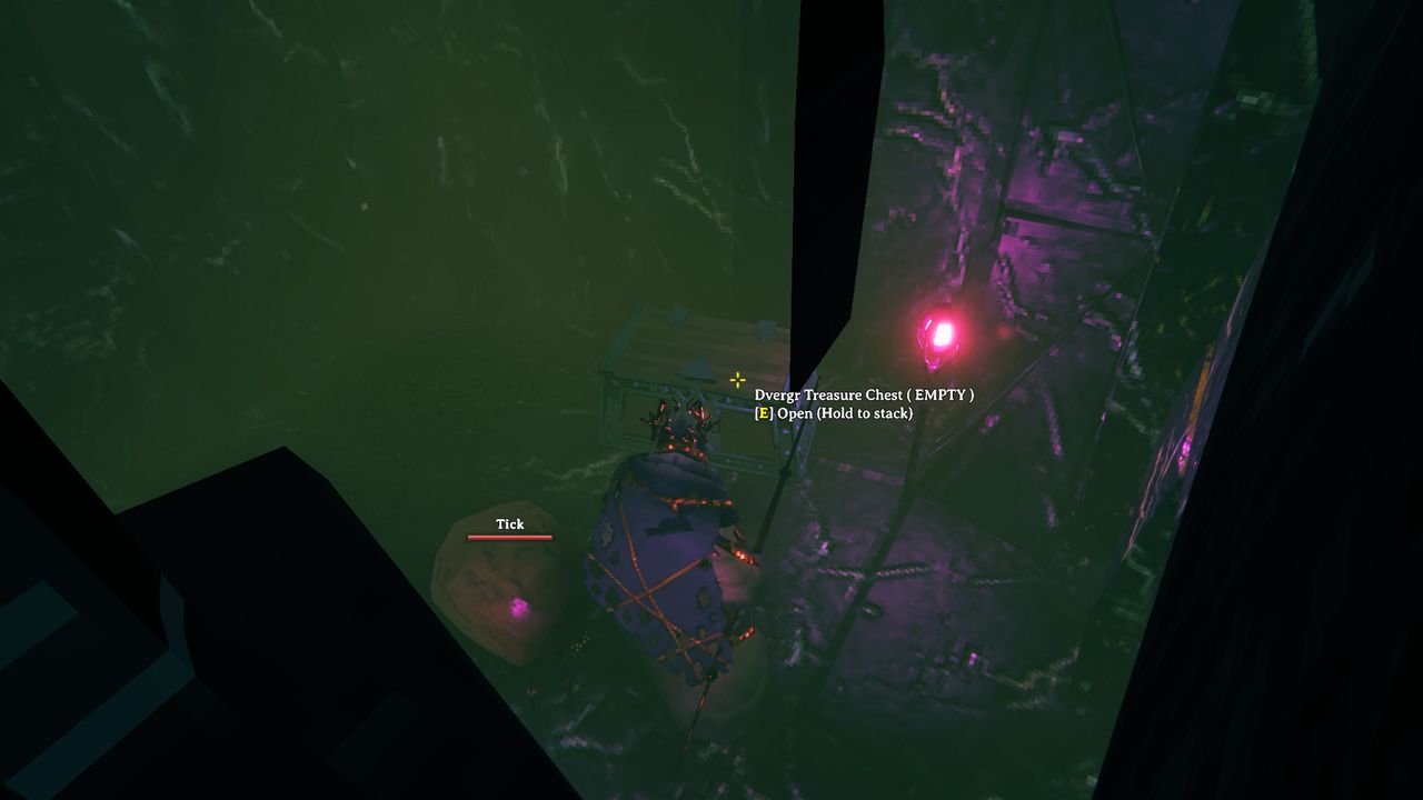 Valheim - A player interacting with a treasure chest in a Mistlands dungeon.