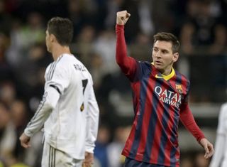 Lionel Messi celebrates after scoring for Barcelona against Real Madrid in March 2014.