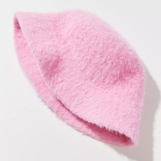 flat lay of urban outfitters pink fuzzy bucket hat
