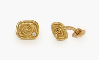 Gold spiral cufflinks with a diamond