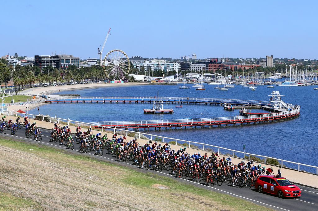 The peloton rolls out of Geelong to get the race underway