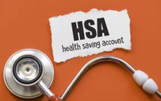 HSA health saving account words on a small piece of paper.