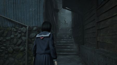 A girl looks at a monster in Silent Hill f