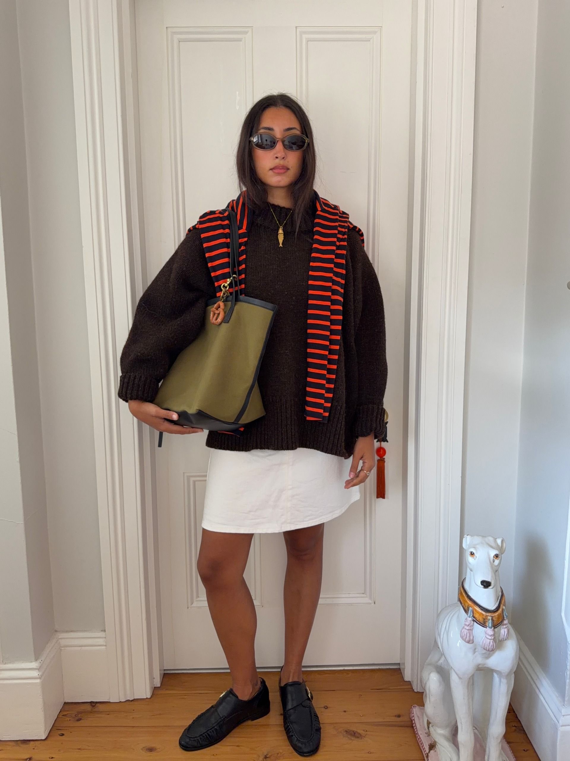 A woman wearing a fall sweater outfit in 2026.