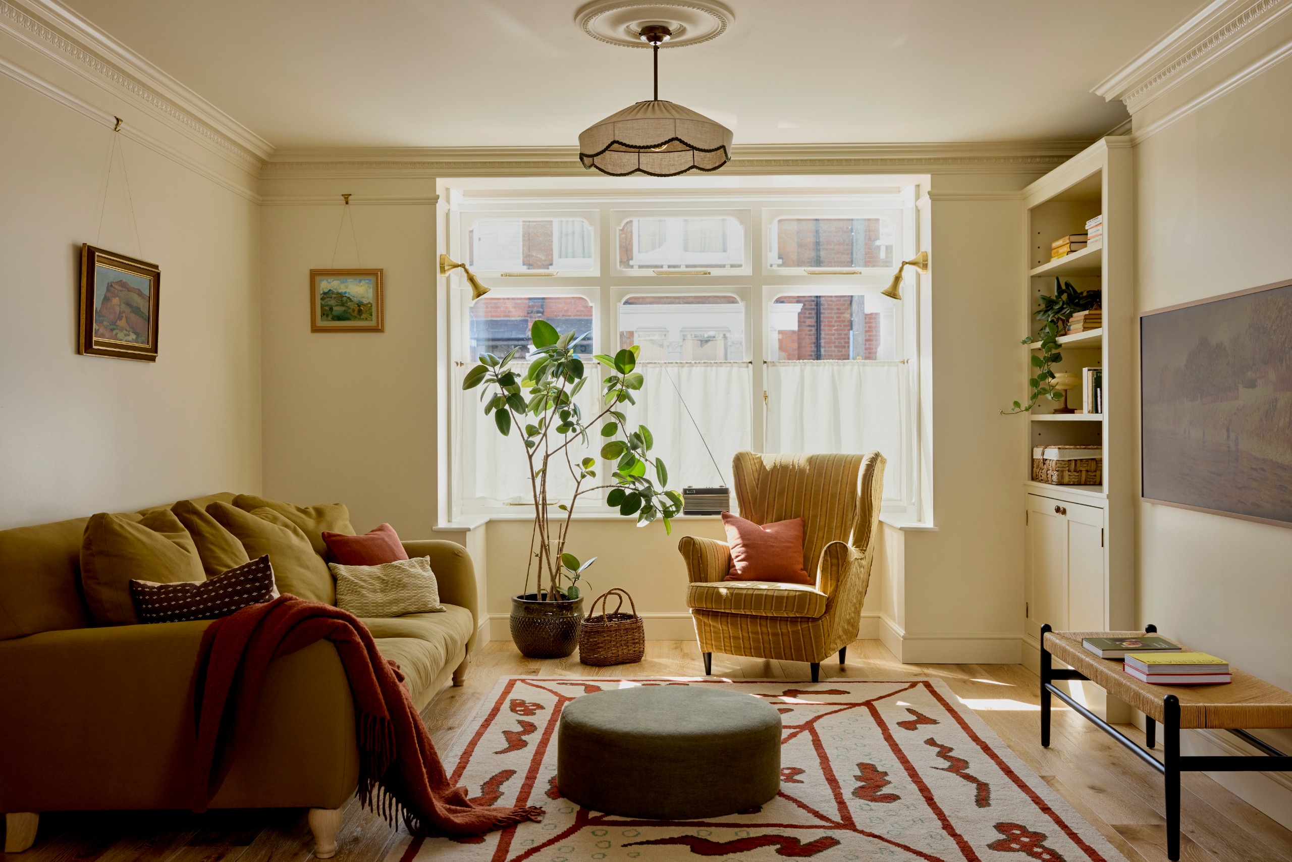 Modern living room in London with neutral tones and flashes of color