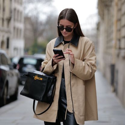 black friday hacks - woman checking her phone 1474403840