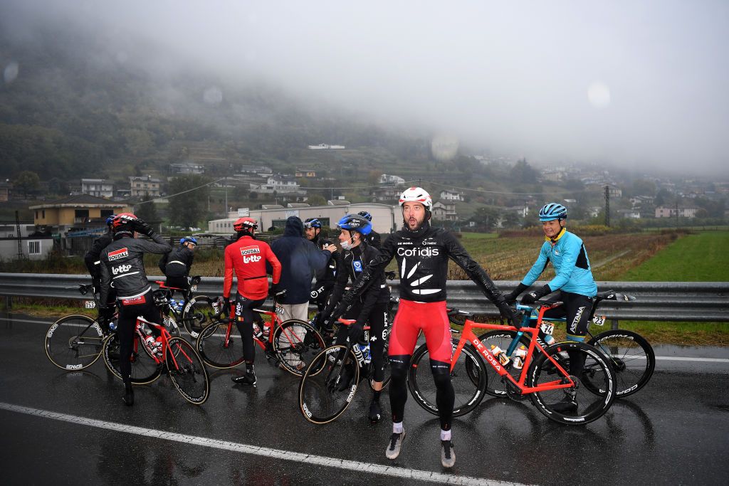 Riders had to wait in the rain for their team buses