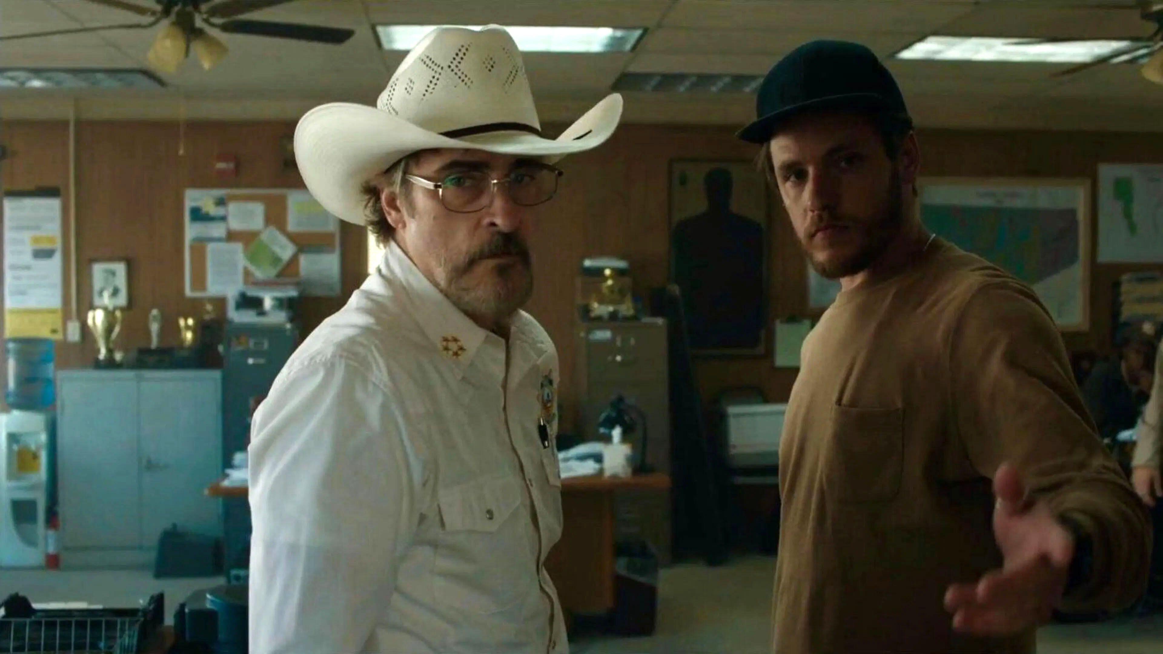 (From L to R) Joaquin Phoenix as Joe Cross and Luke Grimes as Guy in Eddington