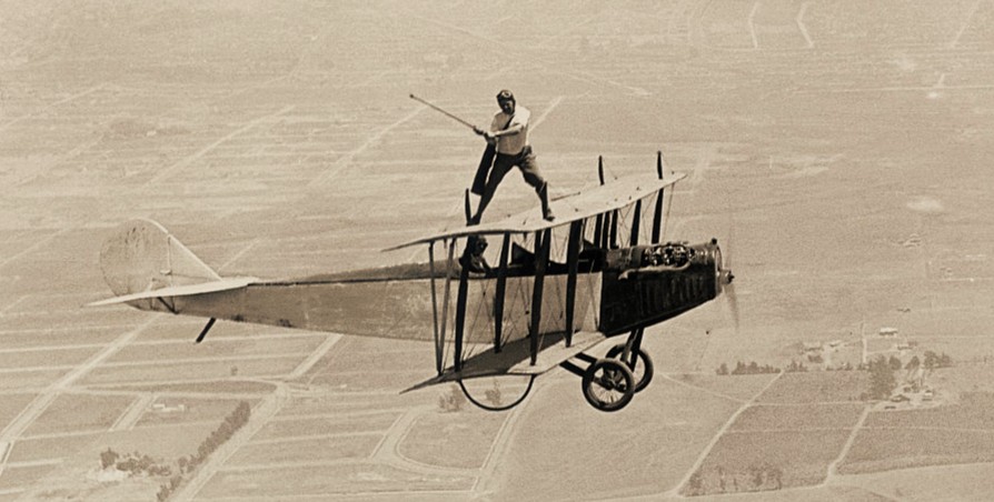 Stunt flier Al Wilson becomes the first man to drive a golf ball off a plane&amp;rsquo;s wing while the plane is flying